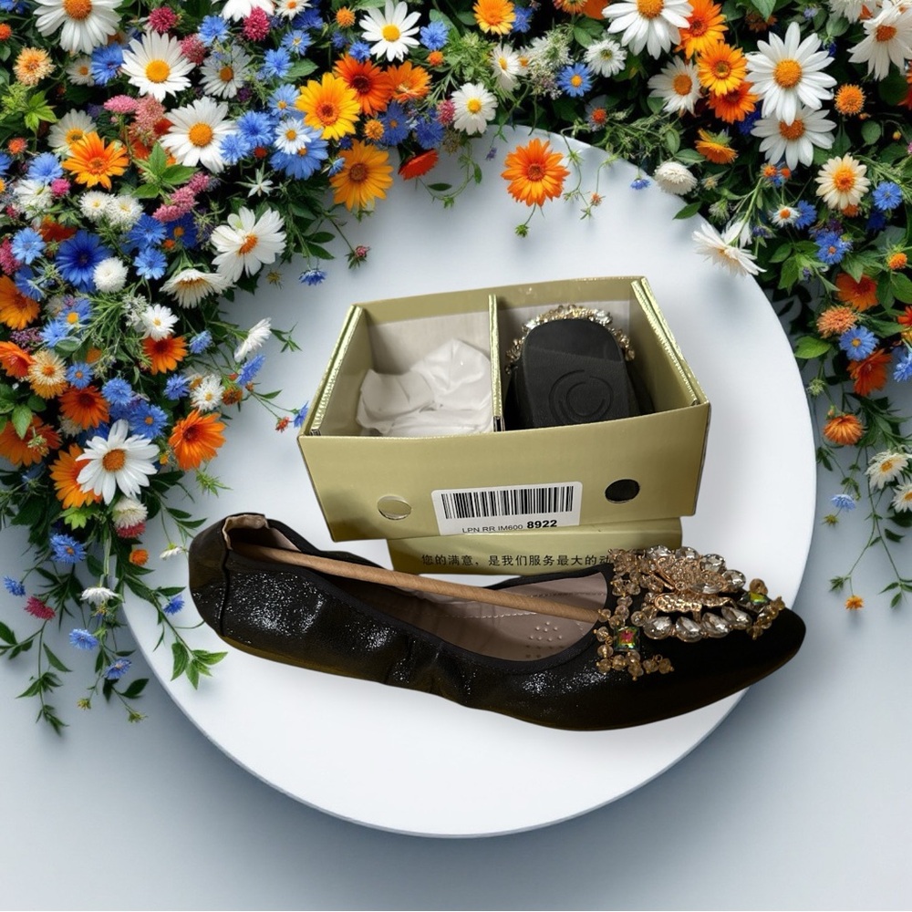 New in box Womens size 9 shiny flats with butterfly glitz design on toes.